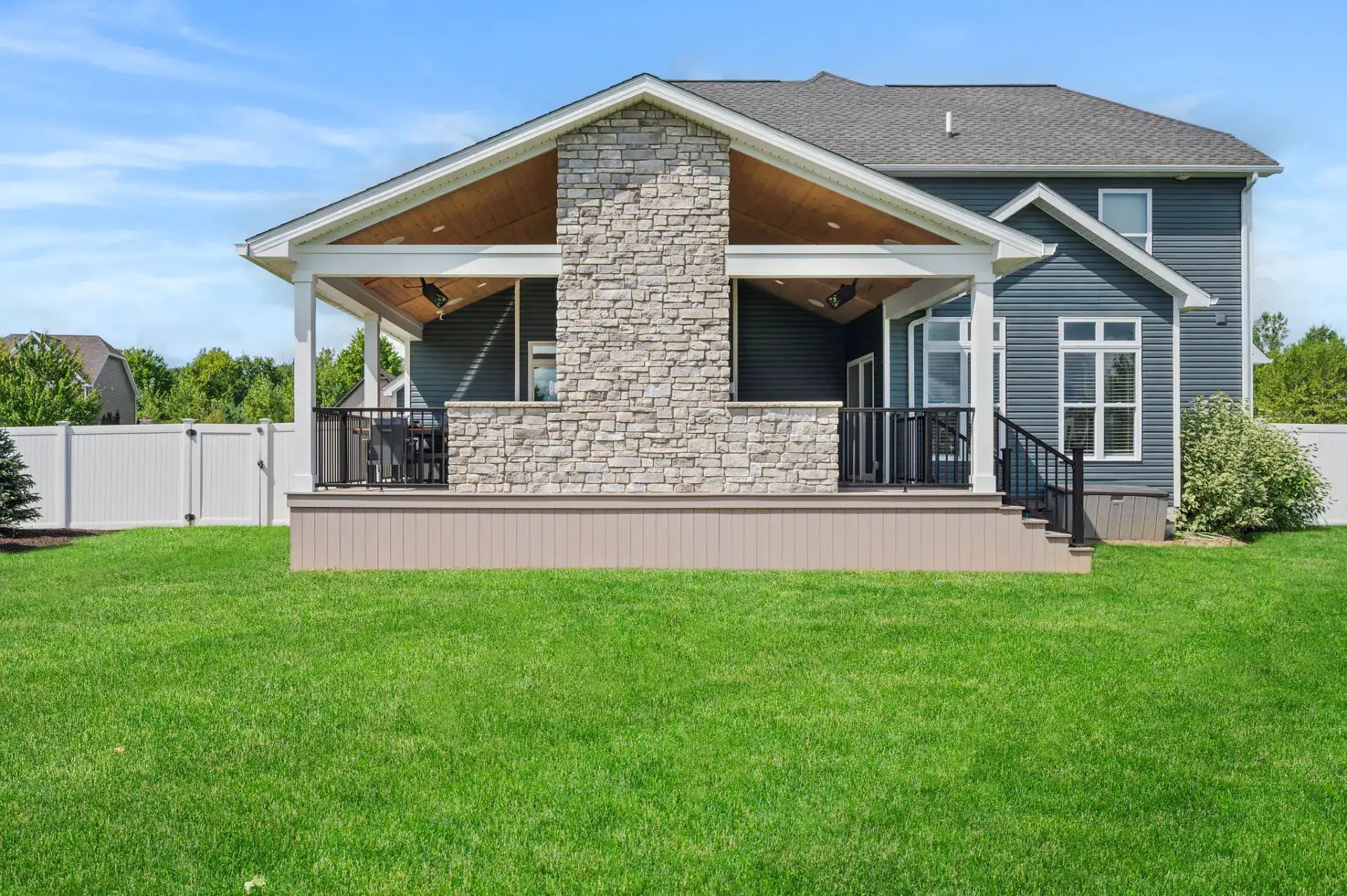 Covered Porch with Stone Fireplace in Medina