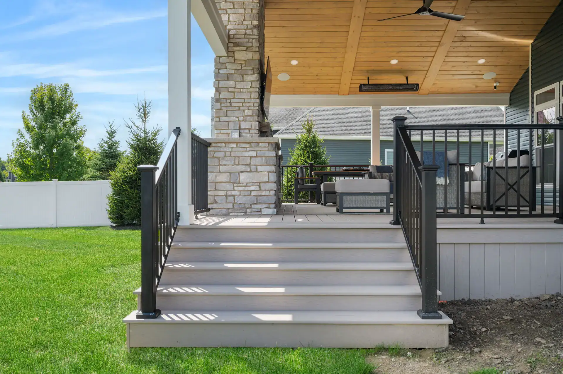 Composite deck steps with black aluminum railing in Medina, Ohio by TAB Property Enhancement
