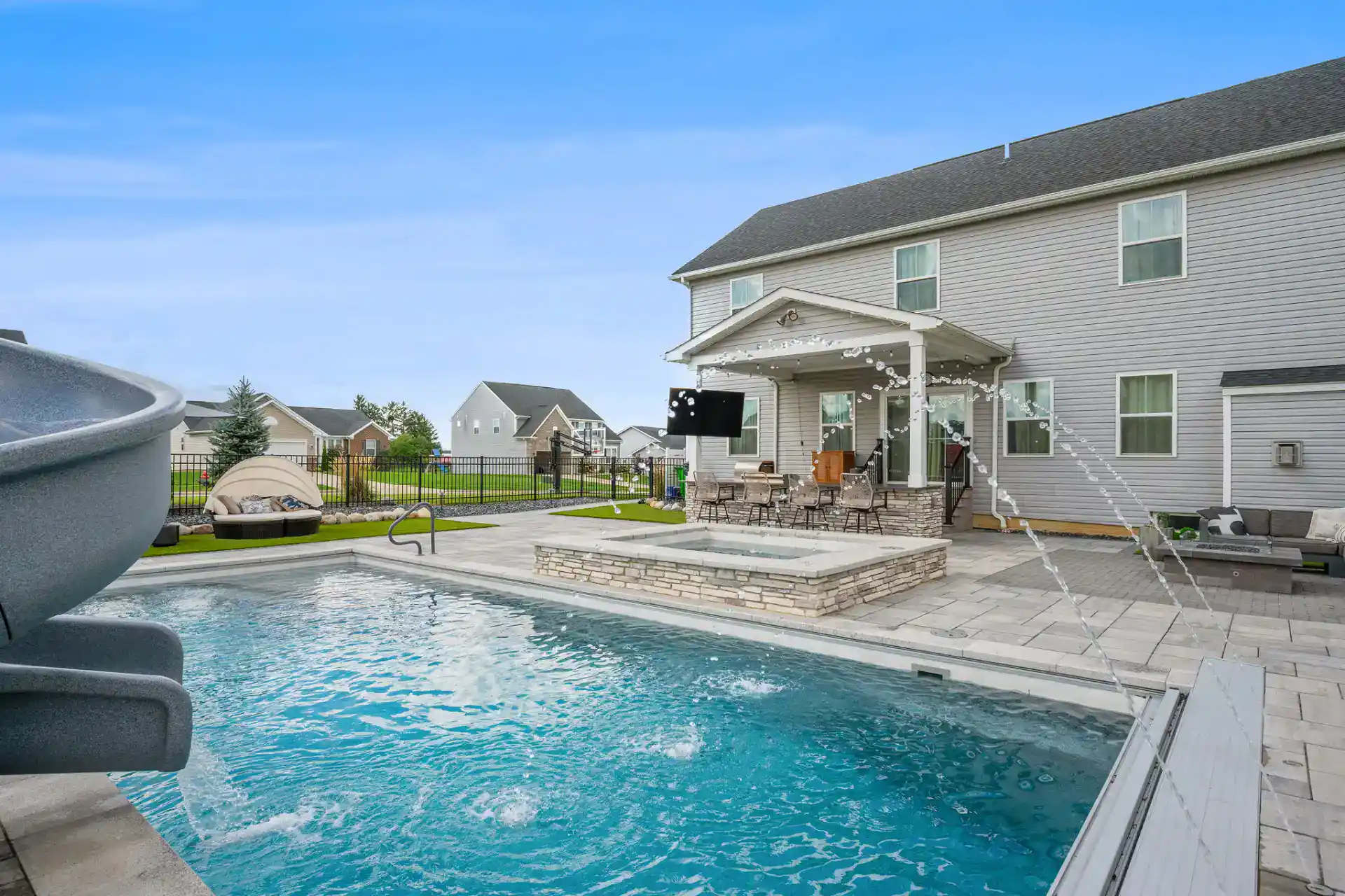 Paver Pool Deck with Outdoor Kitchen and Turf in Medina
