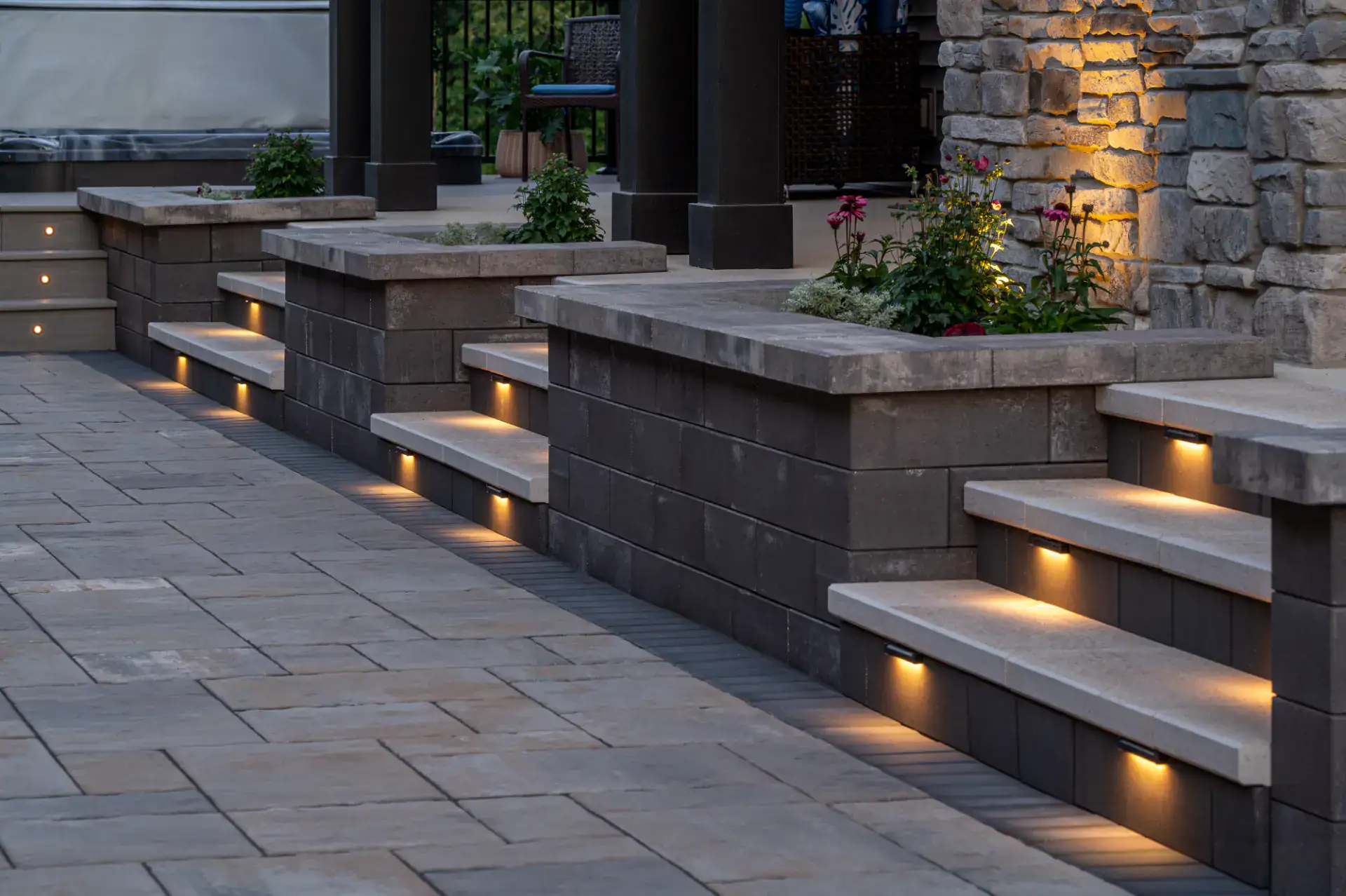 Gas fire pit viewed from under a louvered pergola in Hinckley, Ohio by TAB Property Enhancement