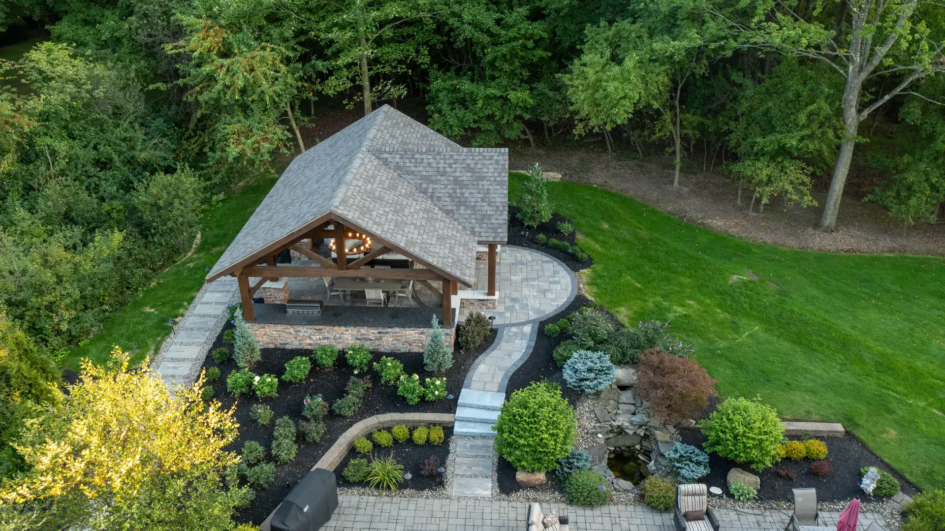 Timber frame pavilion on a paver patio in Pepper Pike, Ohio by TAB Property Enhancement