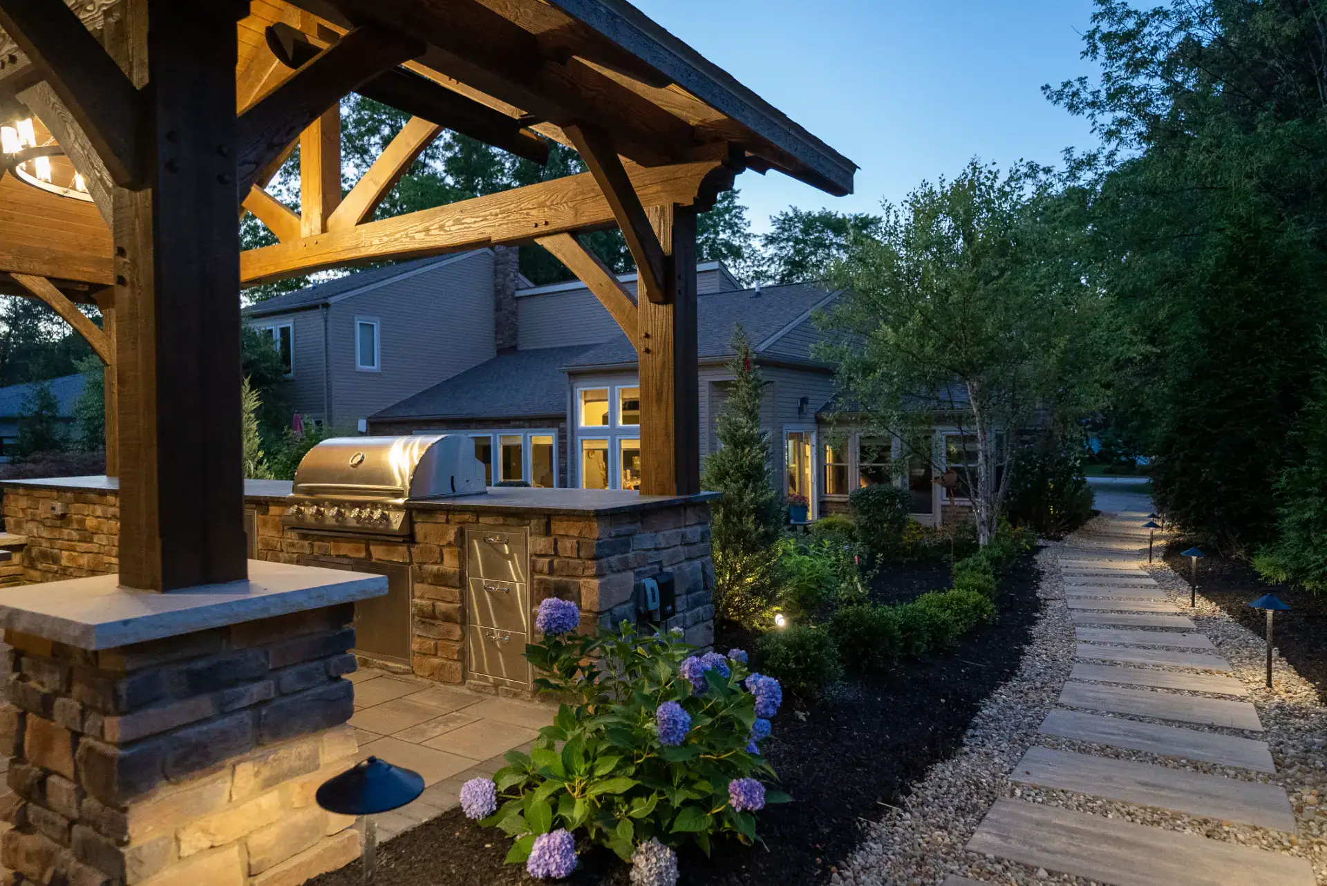 Timber pavilion with chandelier and low voltage path lighting in Pepper Pike, Ohio by TAB Property Enhancement